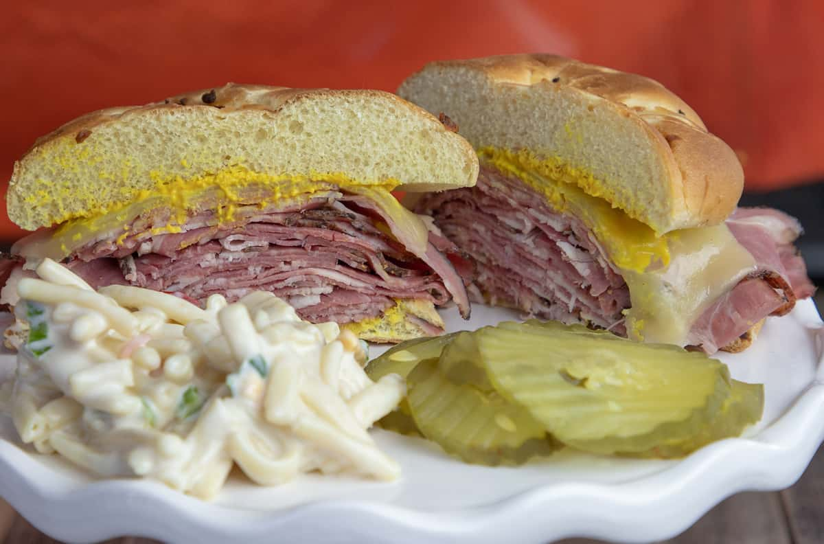 HOT PASTRAMI ON ONION ROLL WITH PICKLES AND SIDE SALAD Menu Butch's