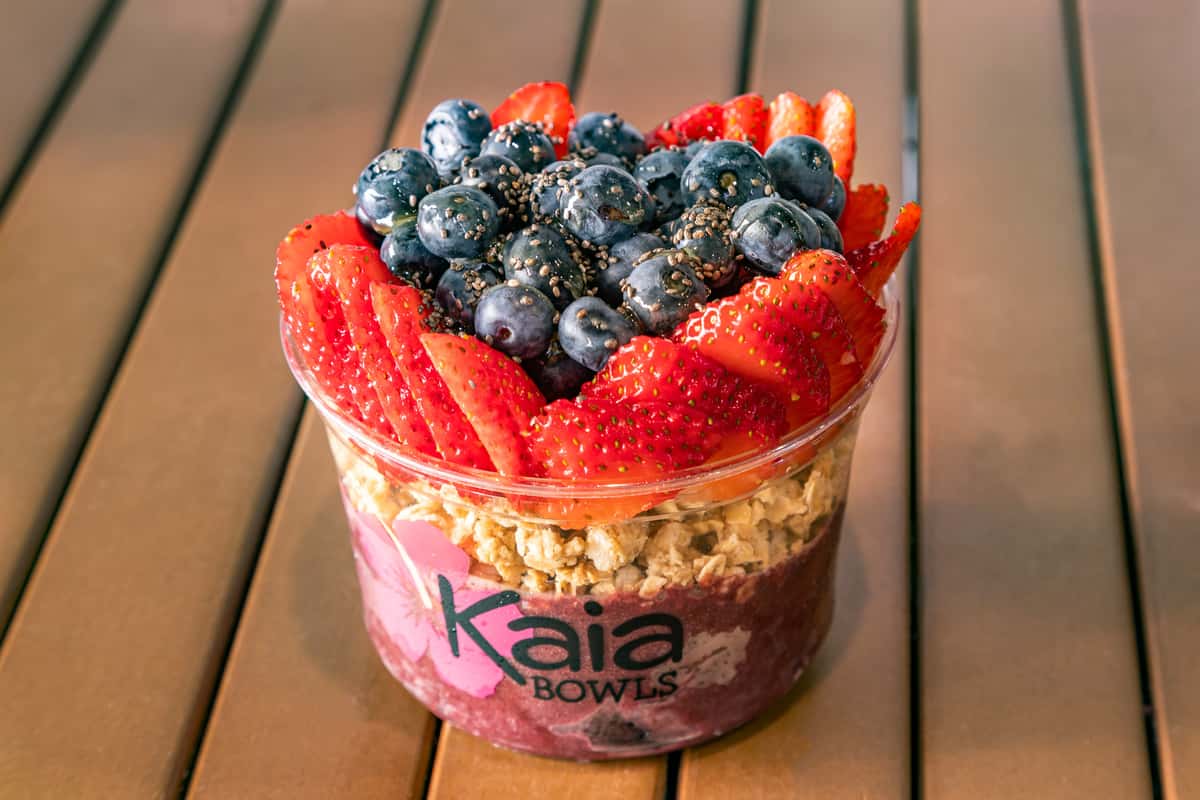 acai base, gluten free blueberry flax granola, freshly cut strawberries, blueberries and chia seeds 