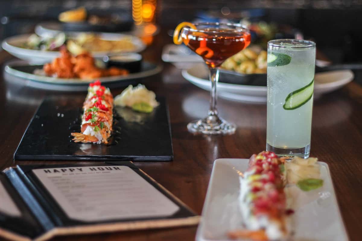 Sushi rolls with cocktail beverages