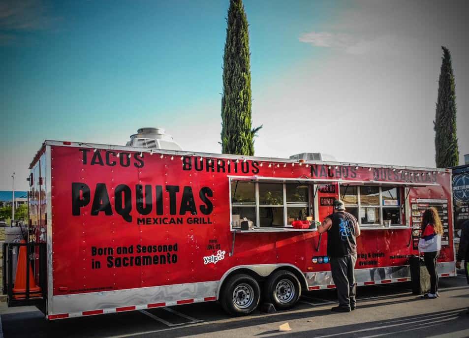 Paquitas Mexican Grill Food Truck with string lights roped along top