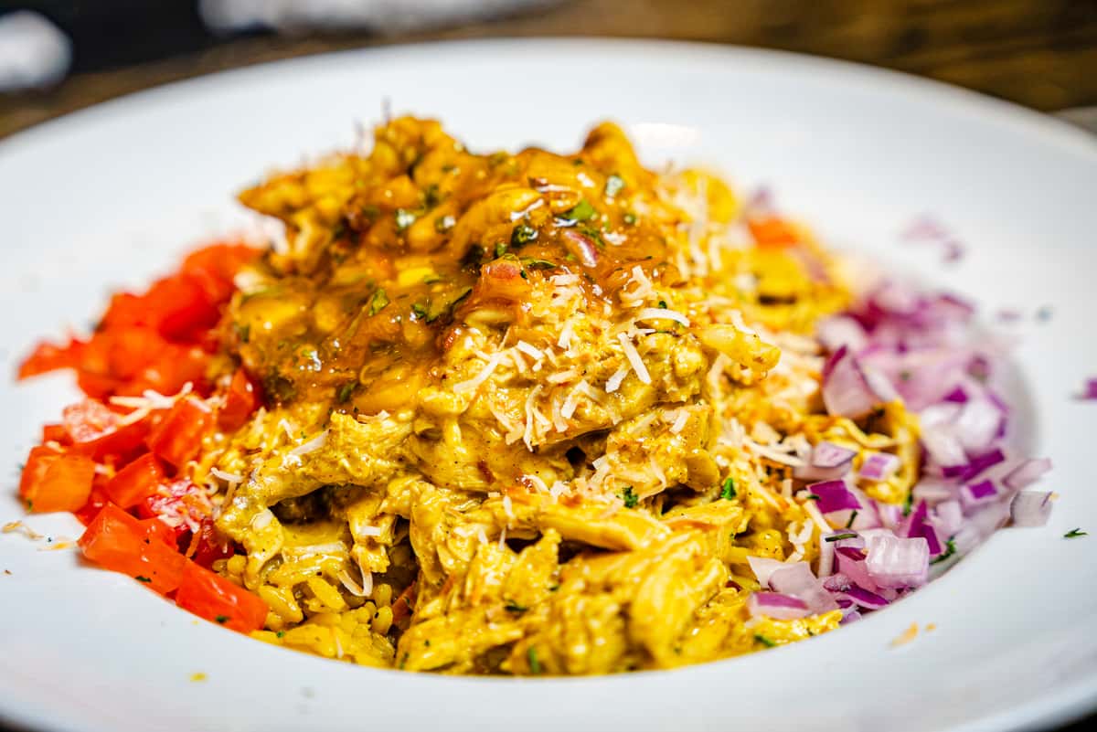 Durban Chicken with saffron rice pilaf and sambol