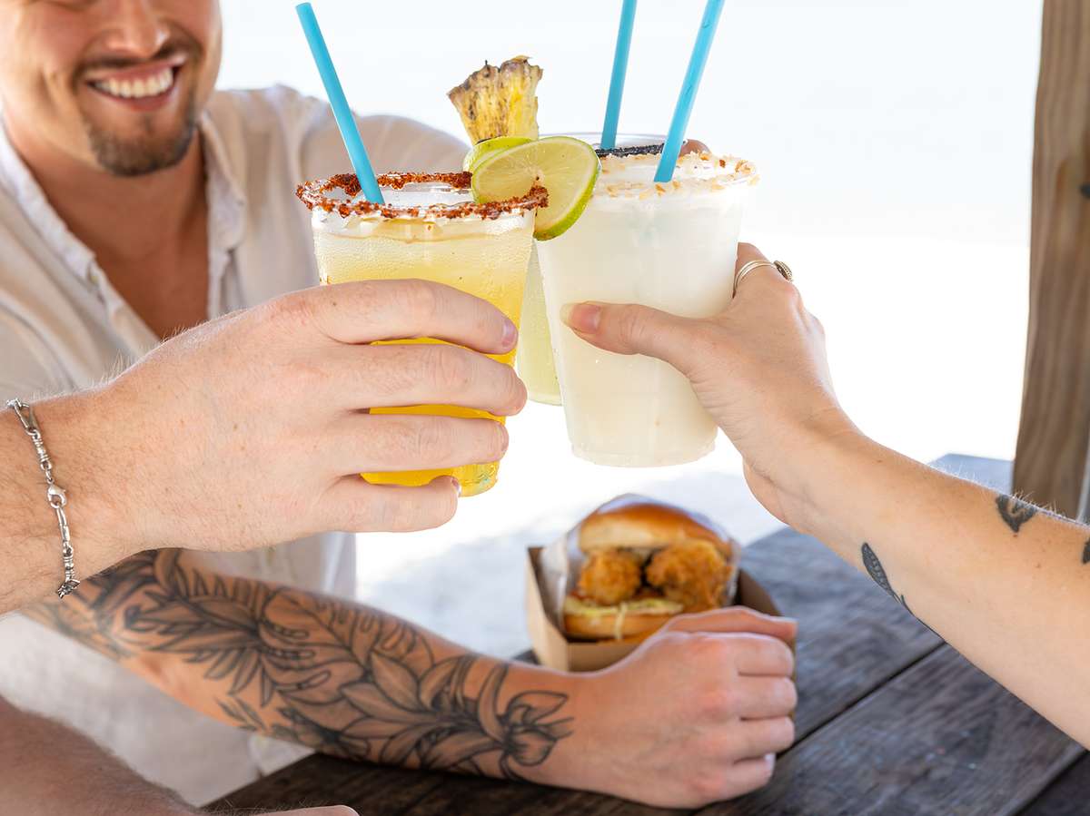 people cheersing cocktails