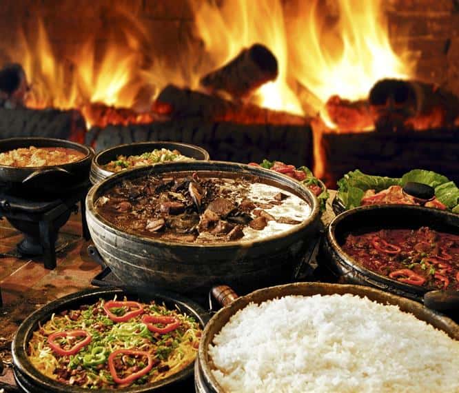 big pots of rice, meat and vegetables