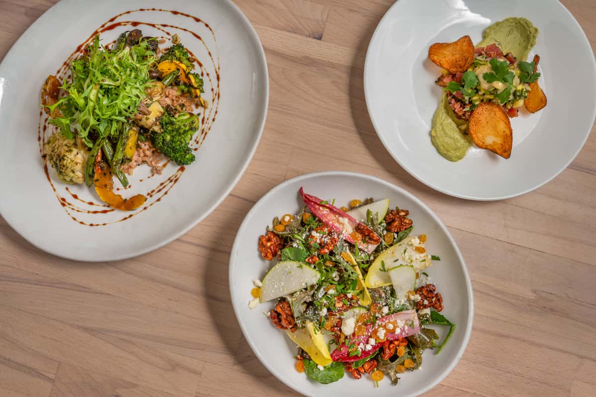 Three entrees of food on a table