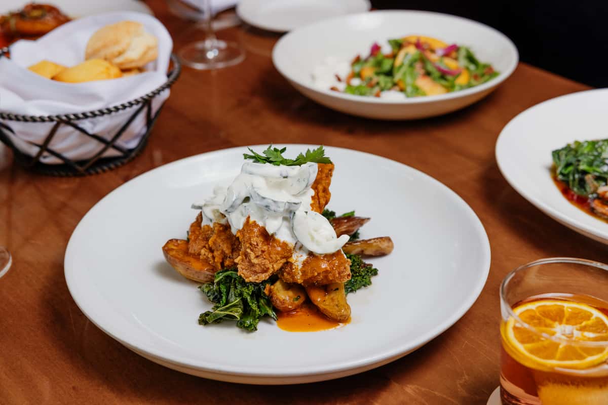 house hot sauce, fingerlings & wilted kale, cucumber-dill sauce