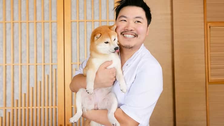 Chef Shen celebrates with his adorable pup, Uni, courtesy of MICHELIN Guide