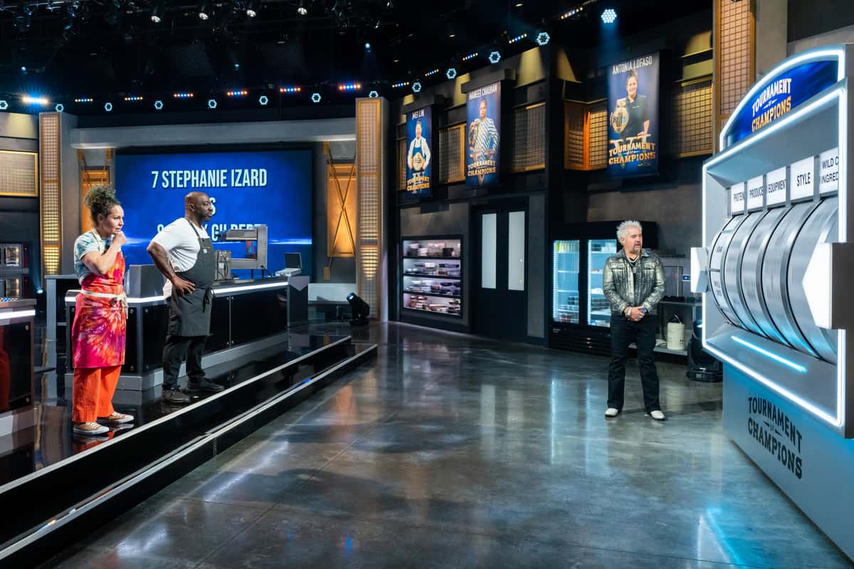 Host Guy Fieri with contestants Stephanie Izard and Kenny Gilbert.jpeg