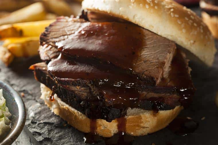 roast beef sandwich dripping with sauce