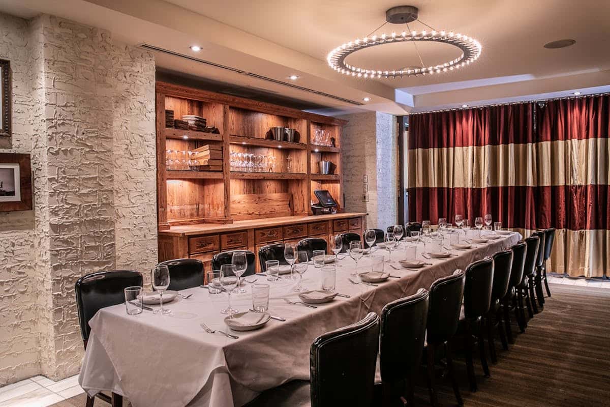 Modern European-inspired dining room with elegant lighting and contemporary decor at Ecco.