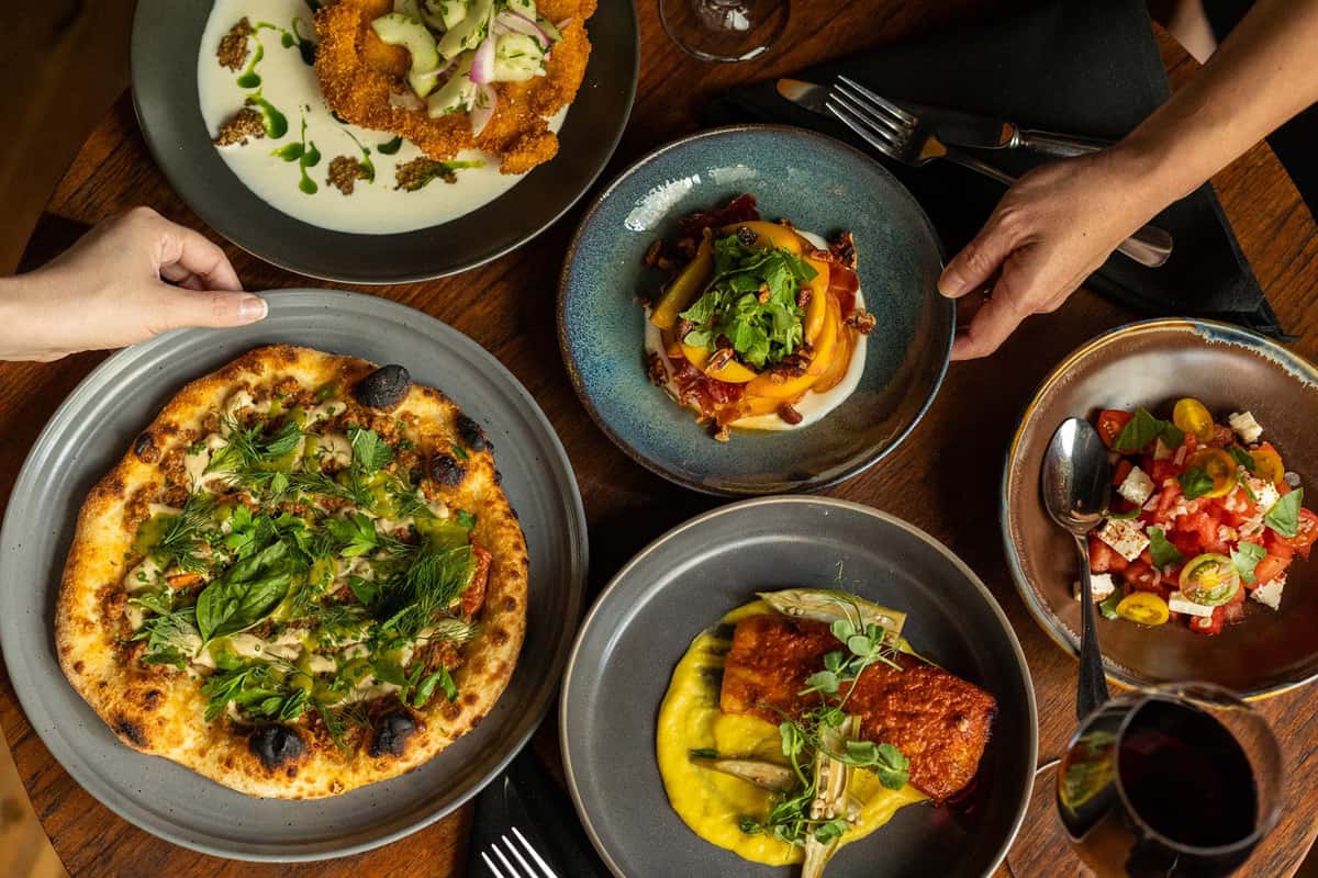 Vibrant assortment of dishes showcasing Ecco's modern European culinary creativity.