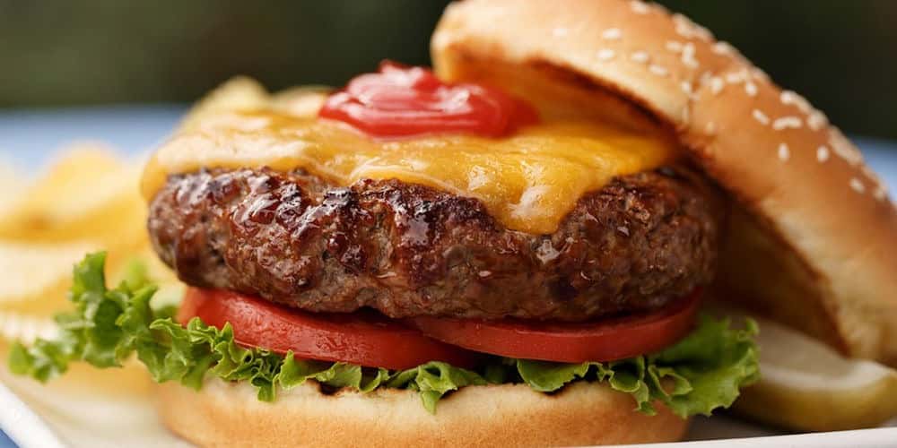 Cheeseburger with lettuce and tomato closeup