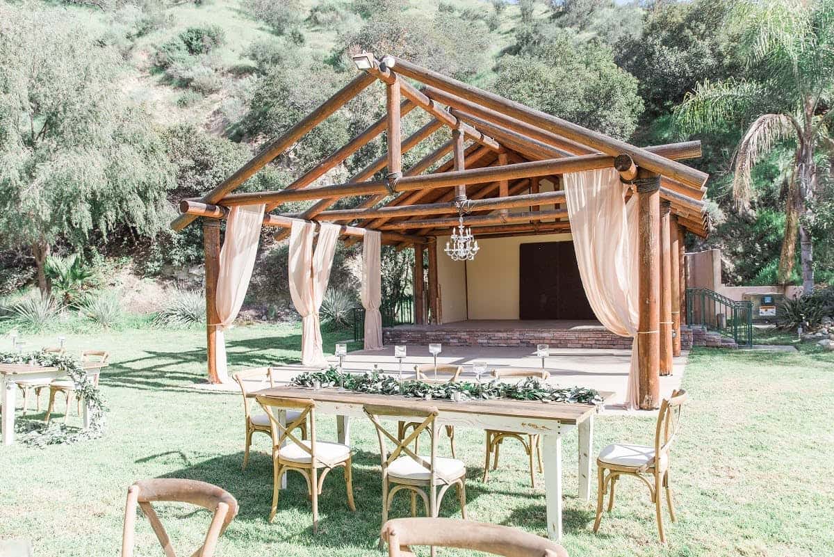 Castaway Garden outdoor wedding set up with wood accents