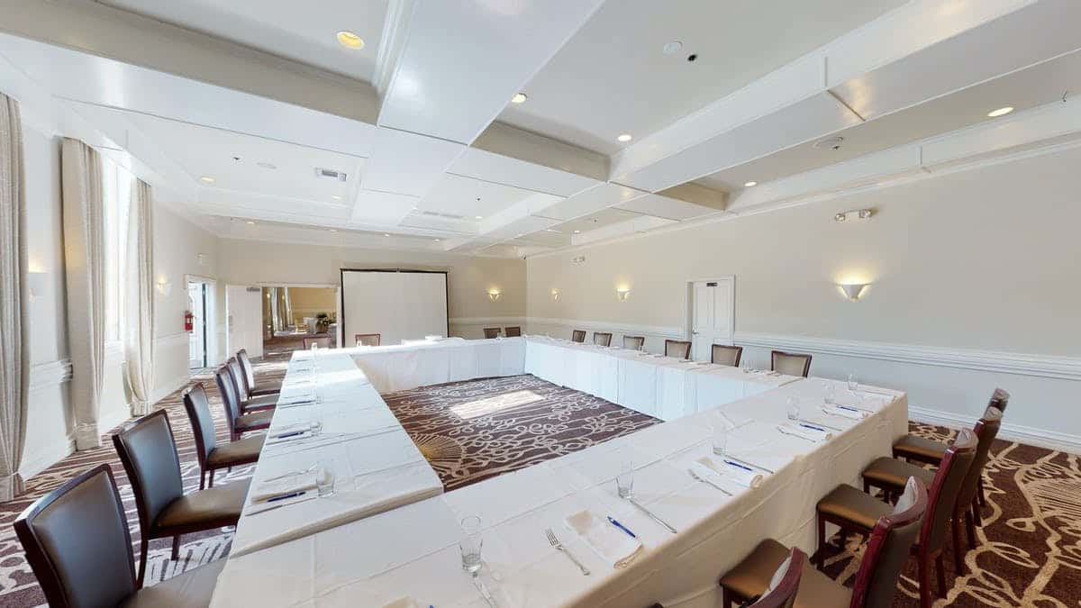 Corporate event set up with tables in rectangle shape