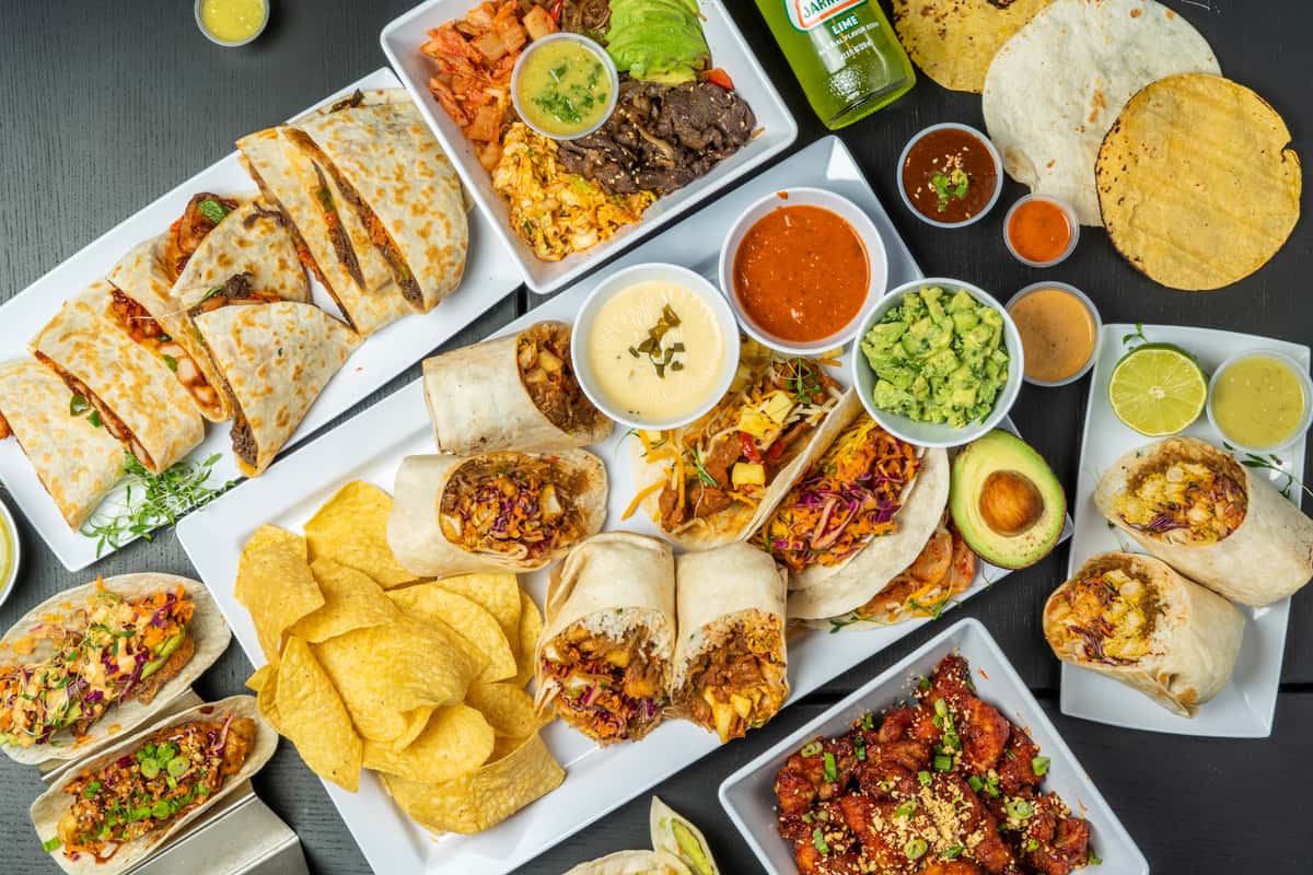 An overview of tacos, burritos, chips, and chicken