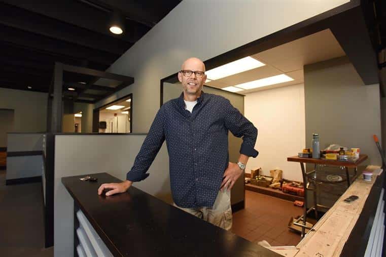 Owner standing at counter