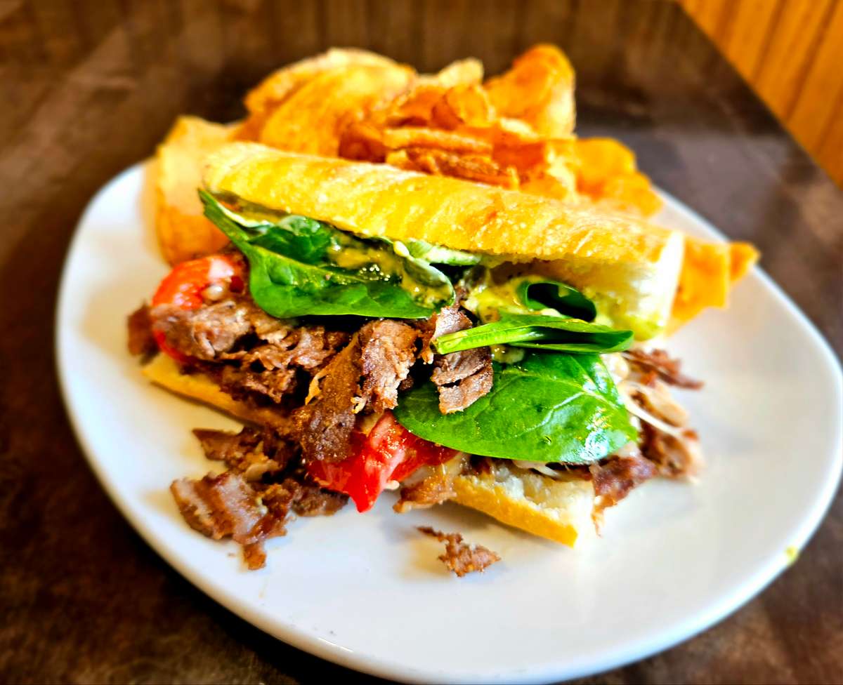 Shaved sirloin topped with pesto aioli, roasted red peppers, spinach and provolone cheese on ciabatta