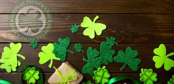 shamrocks various sizes scatured on wood boards