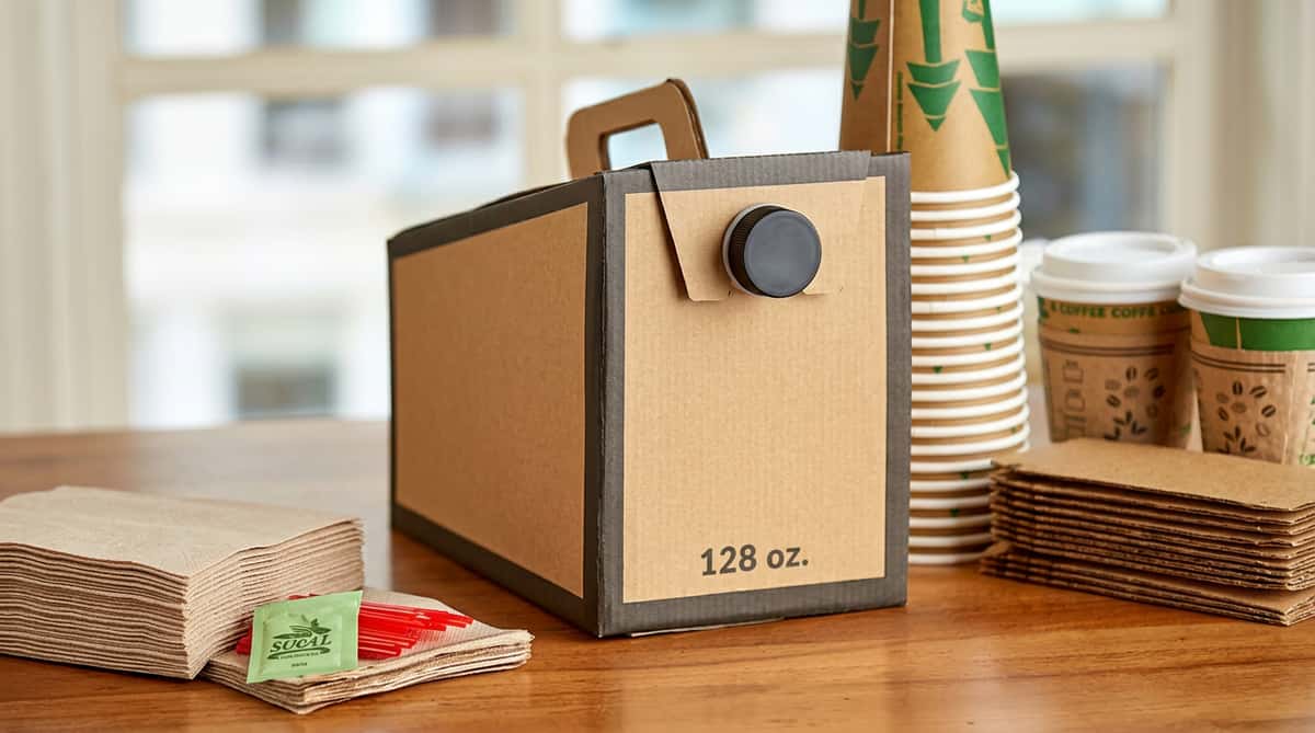 Brown corrugated cardboard beverage dispenser box with a black spigot, 128 oz printed on the side.