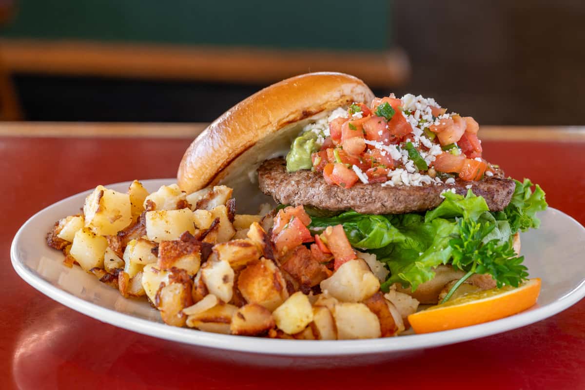 Burger with tomato lettuce and hashbrown