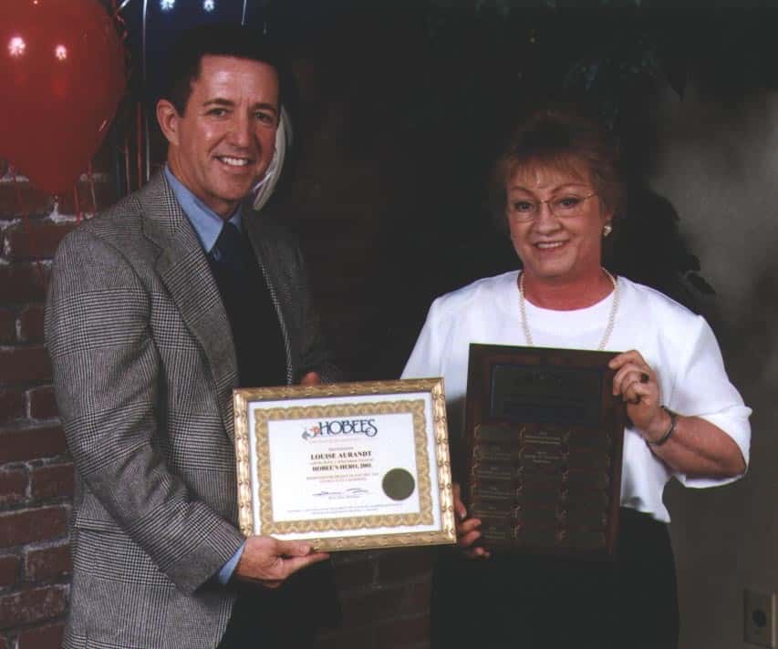 Peter Taber congratulates 2001 Hobee's Hero Louise Aurandt
