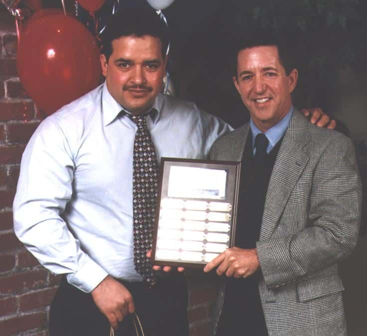 Antonio and Peter holding a plaque