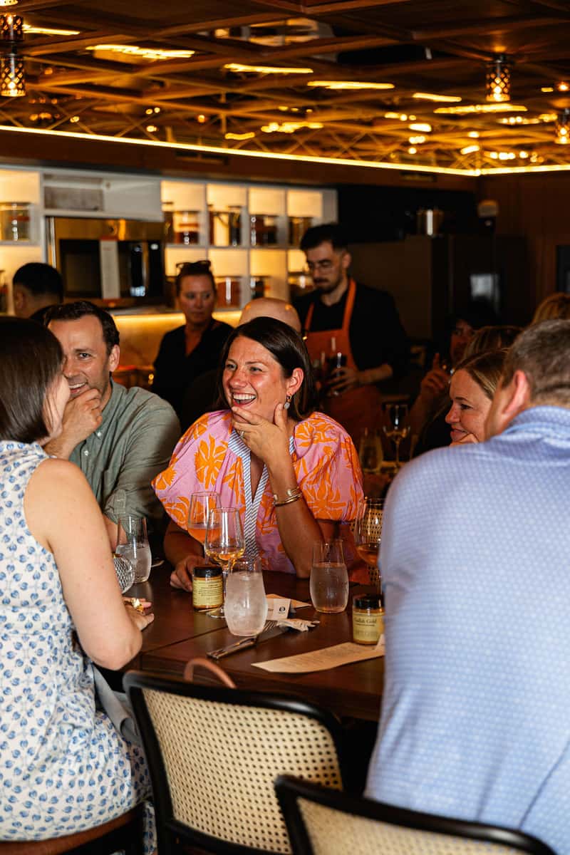candid interior shot of guests laughing