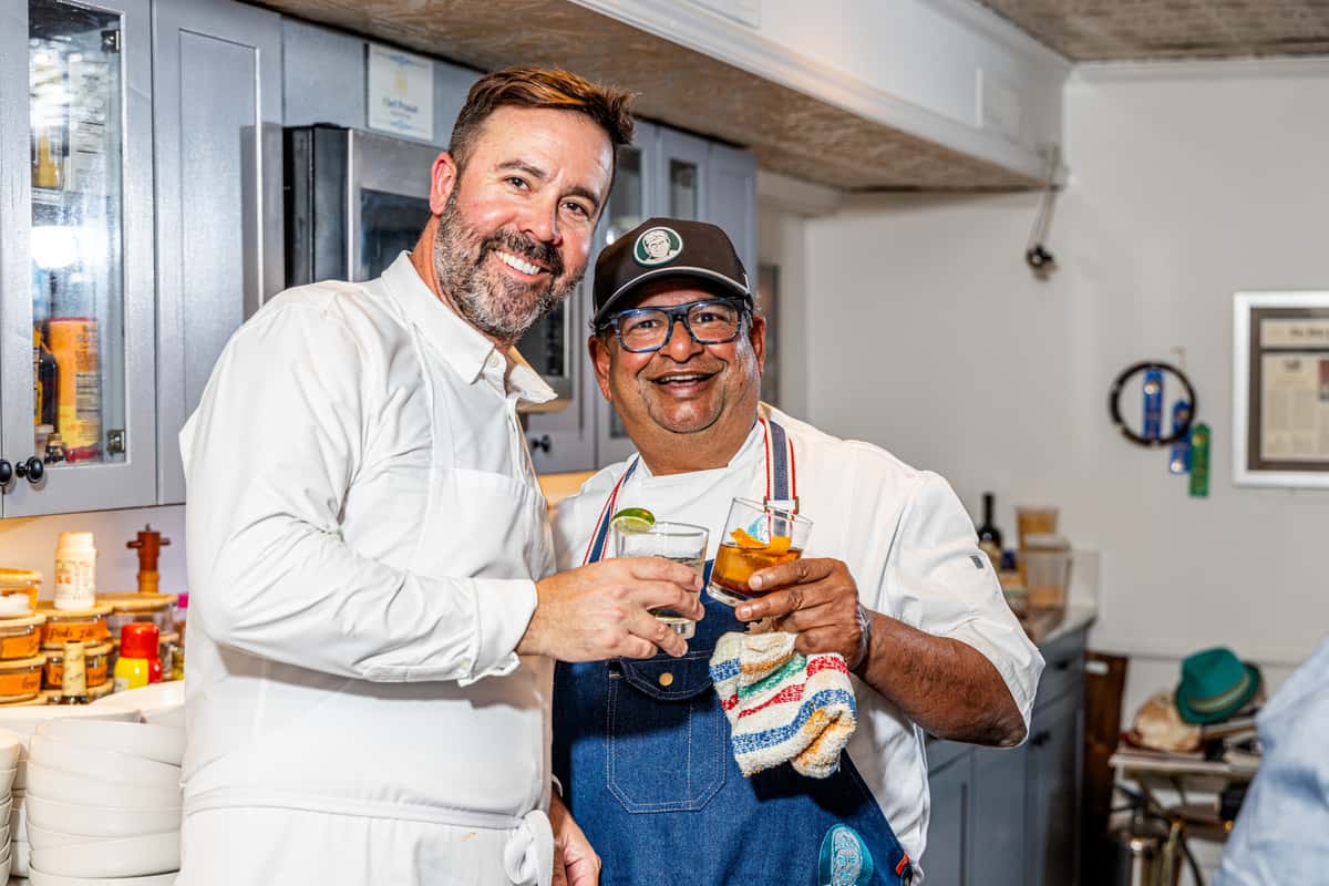 Chef Prasad standing with Chef Luke Venner