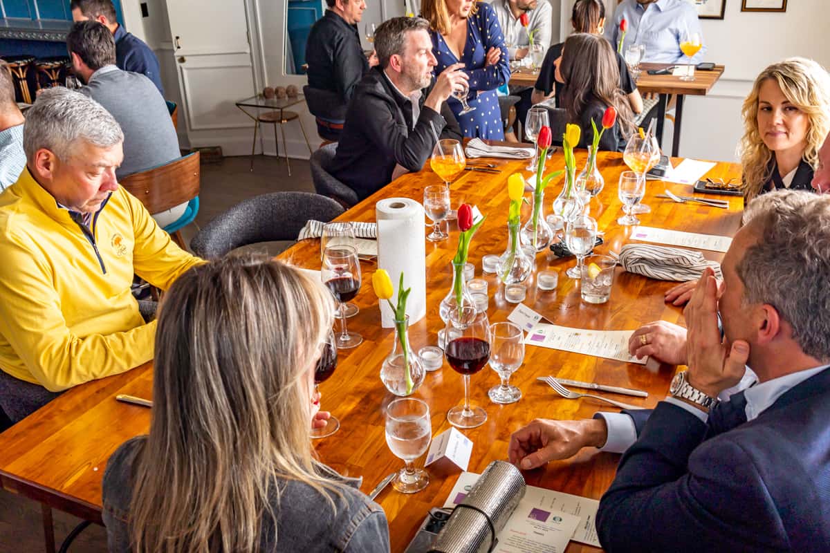People dining around a large table