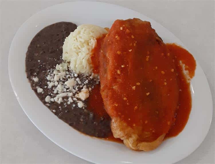Chili Rellenos: Poblano pepper stuffed with queso fresco served with rice and beans.