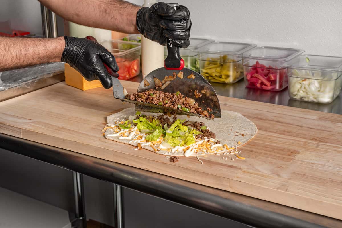Chef plating a customer's dish
