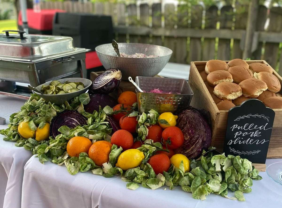 Catering Spread with pulled pork sliders and fruit display