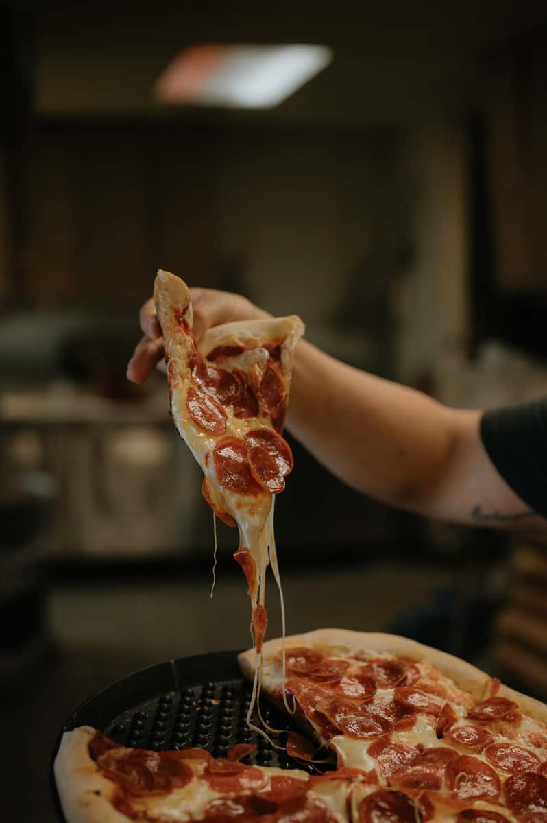 Pizza slice cheese pull