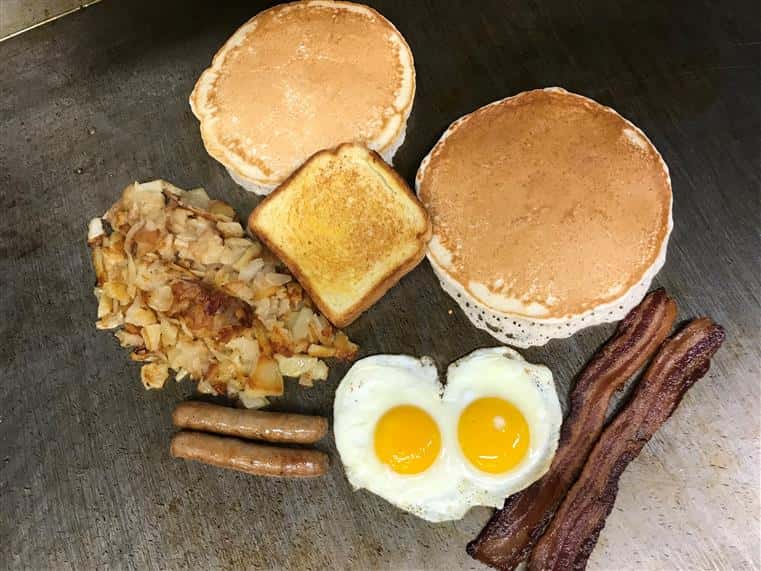 2 pancakes, eggs, sausage, bacon, toast, and hashbrowns