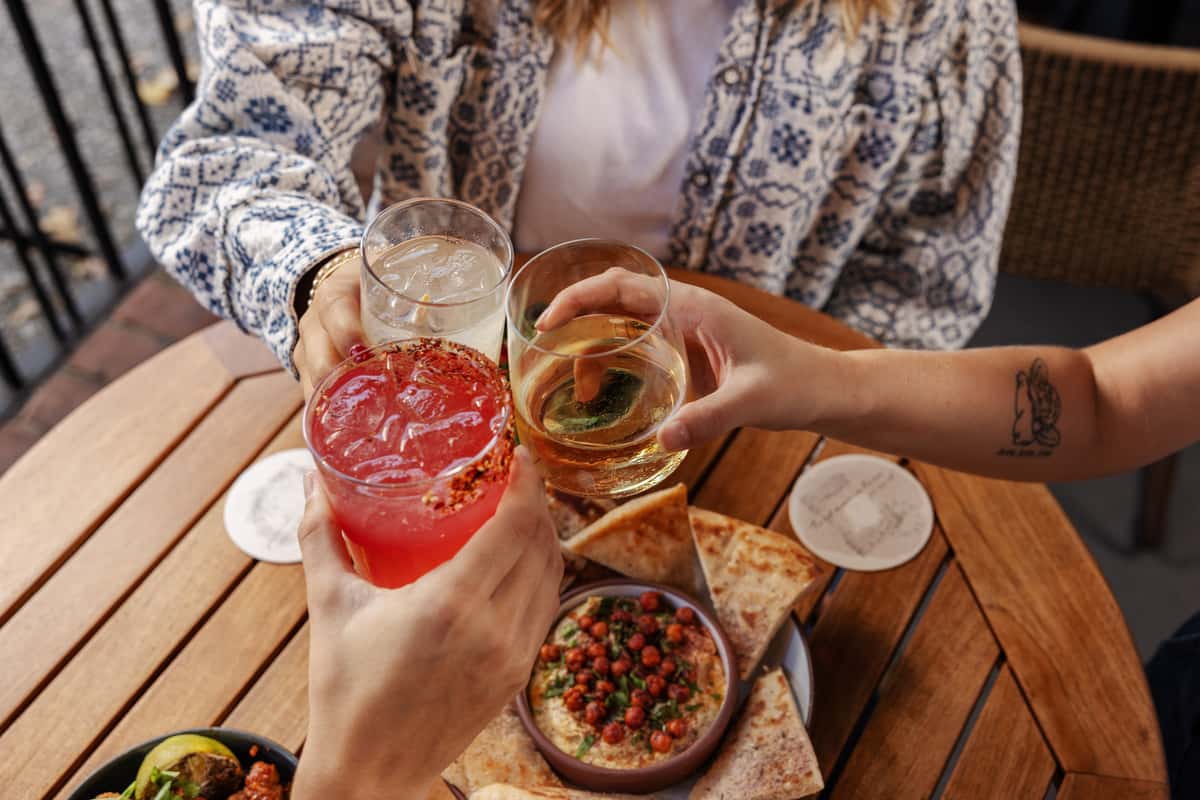 Cheersing at the Table at Ela