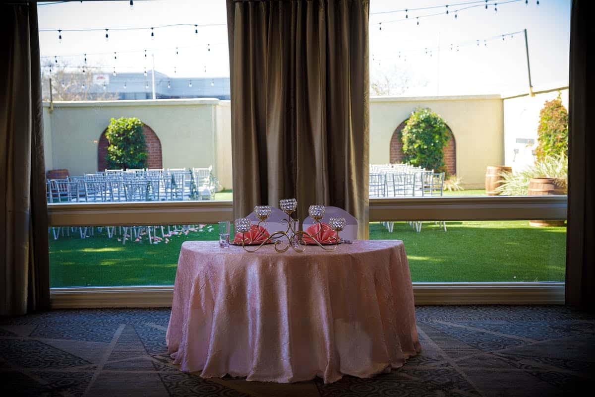 Decorated table in front of large windows