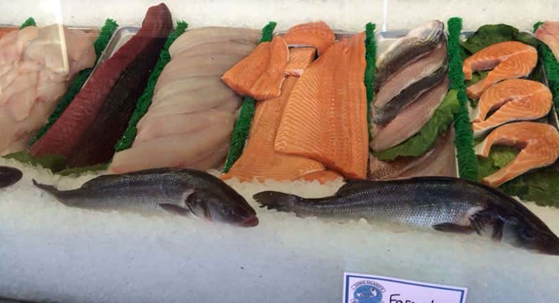 raw fish on display in case 