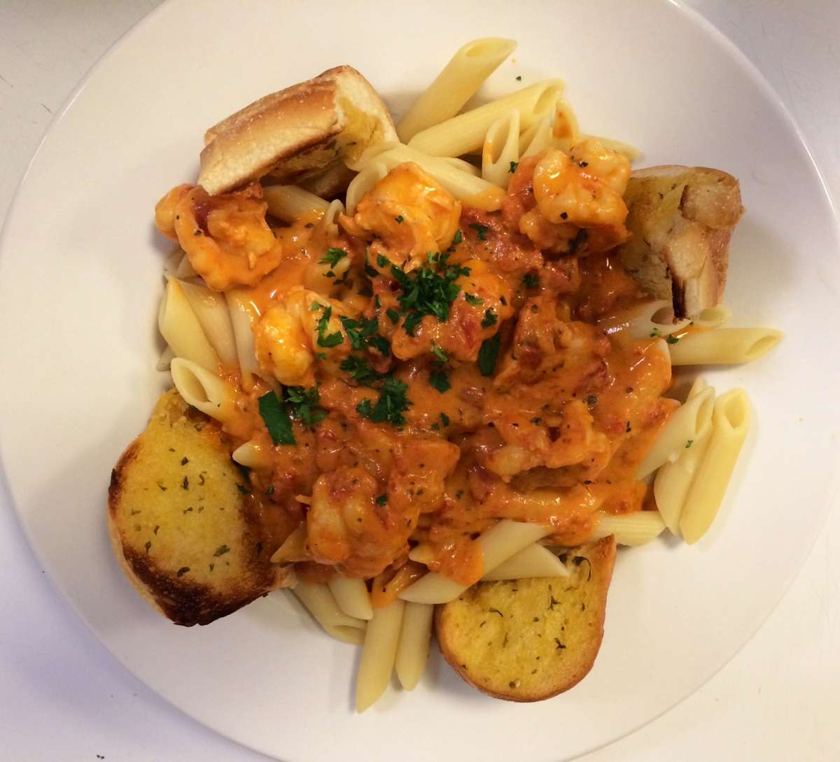 penne pasta with homemade vodka sauce and garlic bread