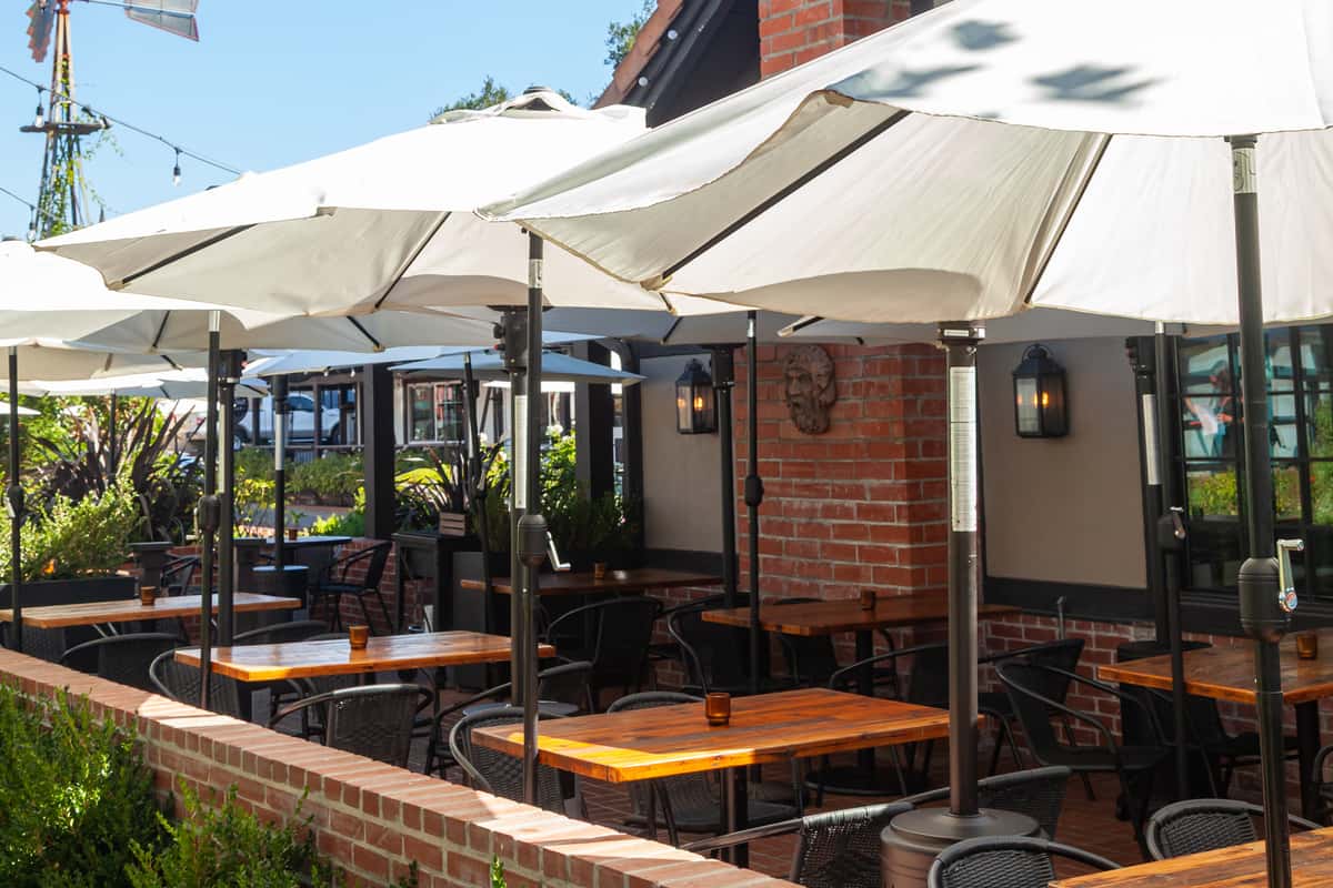 Whiskey 'N Rye restaurant exterior with outdoor umbrellas and tables