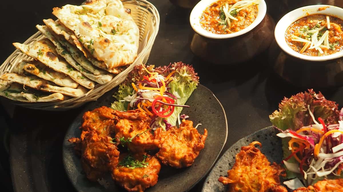 Indian deep fried meat, veggies and naan