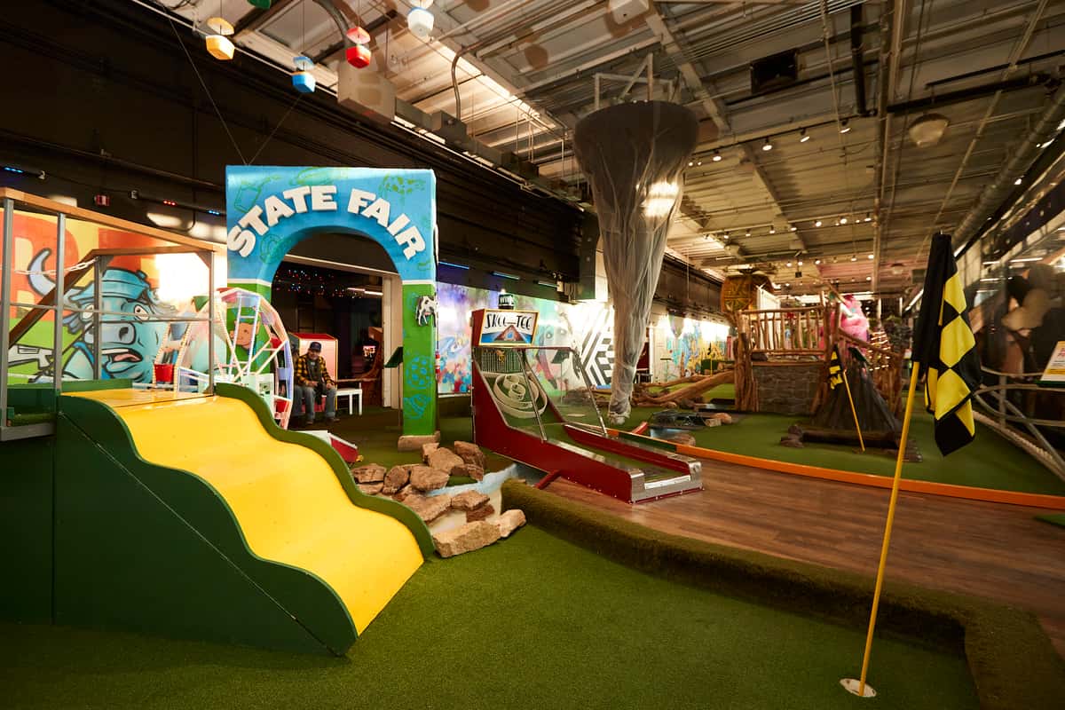 A Wide View Of The Can Can Wonderland Interior Showing The Vibrant Colors Of The Arcade And Mini Golf Areas.
