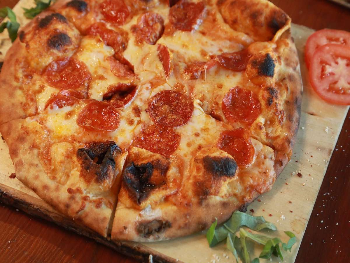 Tomato sauce, shredded mozzarella, shaved Parmesan, and pepperoni