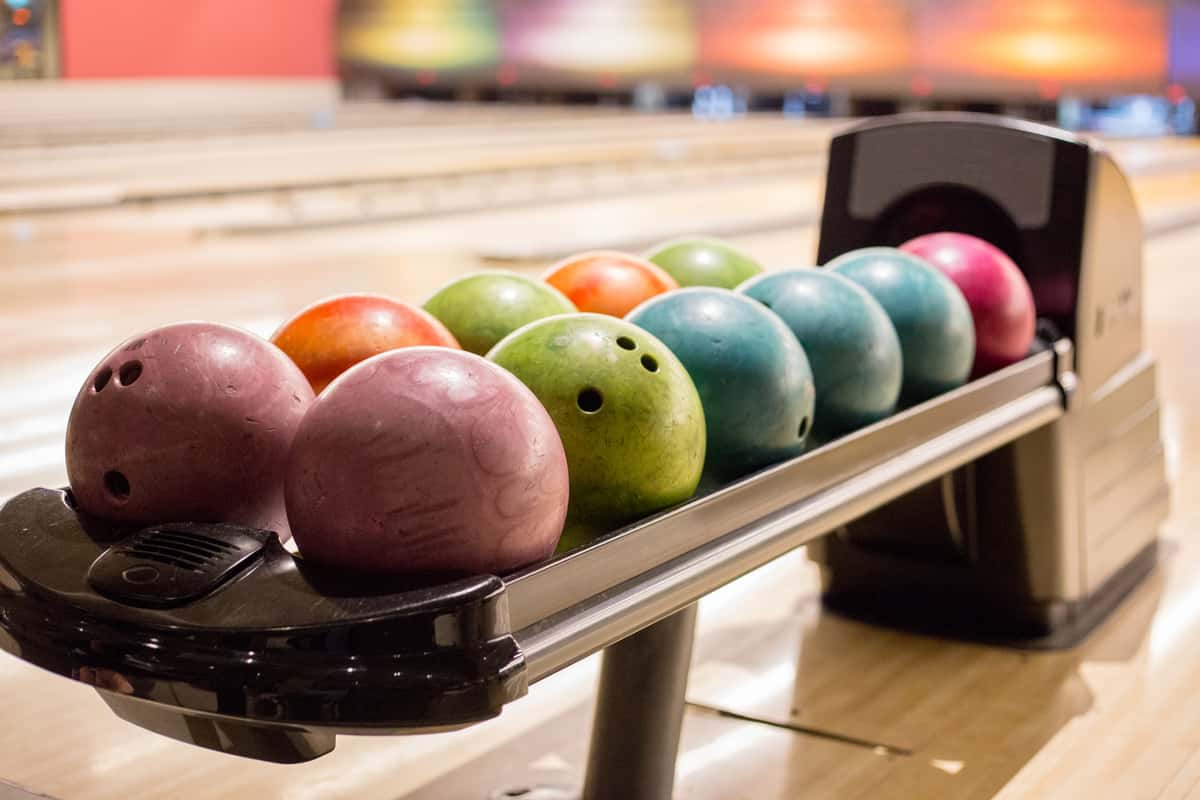 Row of colorful bowling balls
