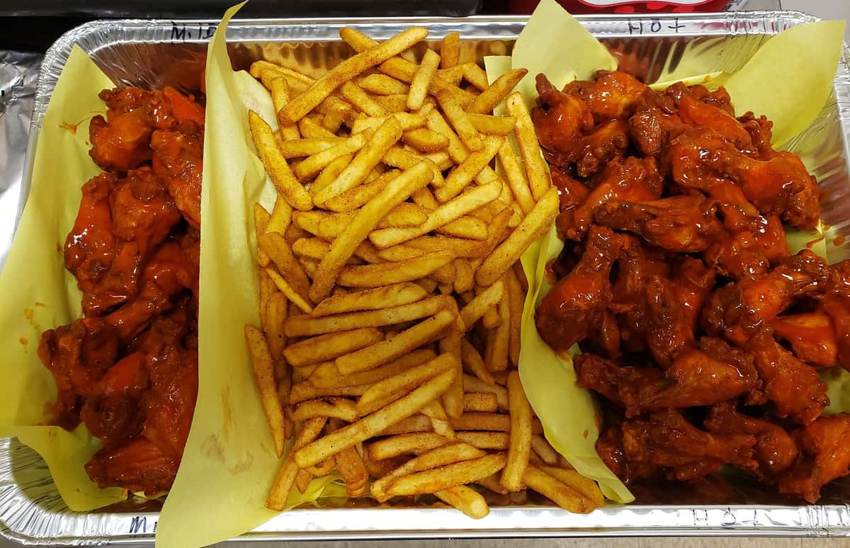 mild and hot chicken wings with fries tray