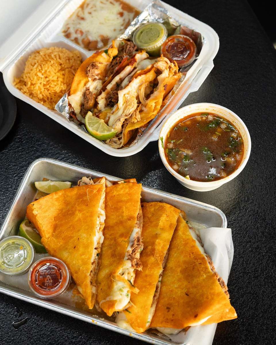table with trays of birria tacos from Vitos tacos in the Las Vegas area