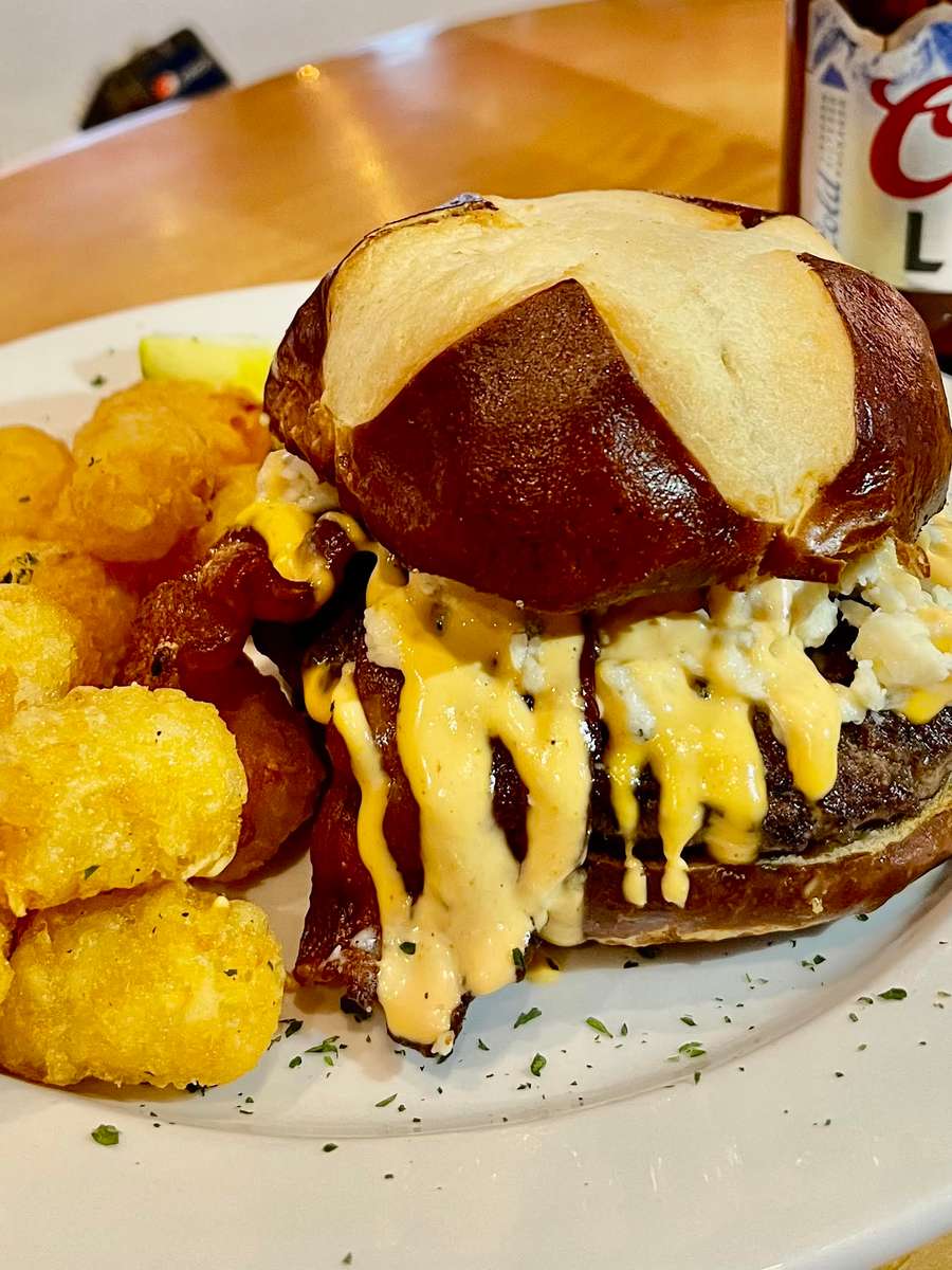 A Bar Rescue Fan Favorite. All beef patty with WI cheddar, caramelized onions, homemade burger sauce served on a seeded bun.