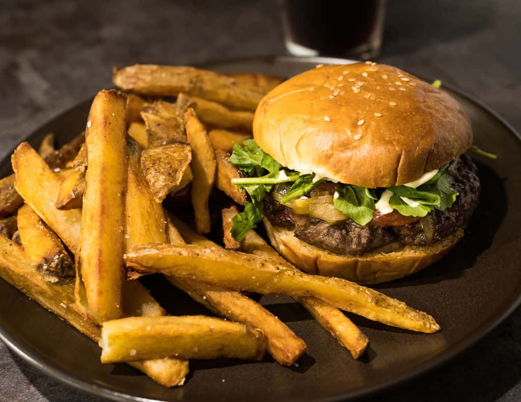Griff's burger with fries and a drink