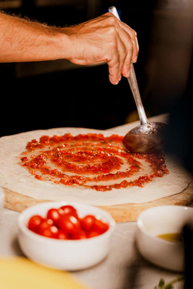 Someone Making Pizza