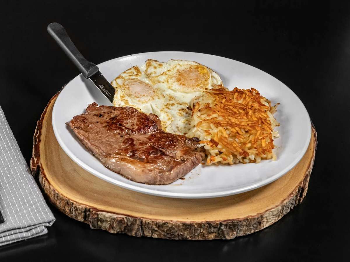 New York steak*, 2 eggs* Any Way You Like 'Em, golden hashbrowns, and 2 buttermilk pancakes