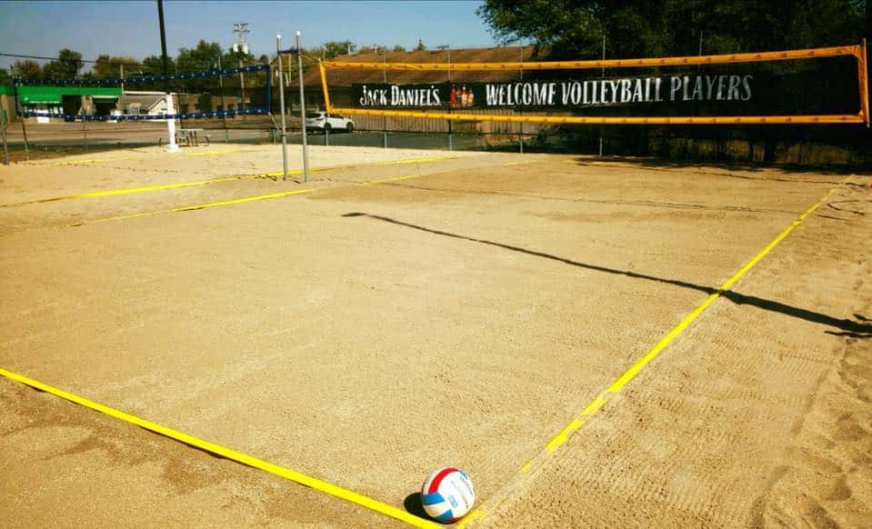 sand volleyball court outside Louie's tap house