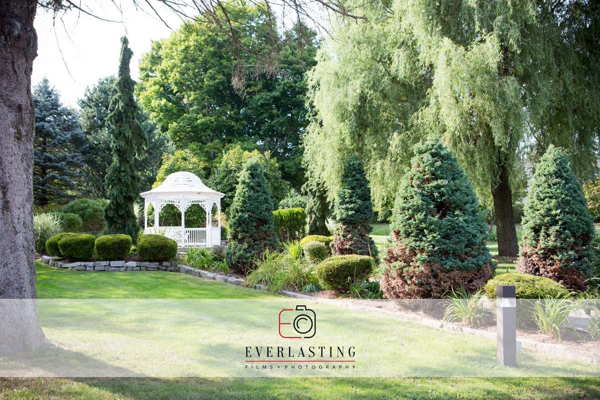 green grass and white gazebo